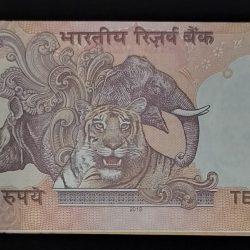 Alternative view of VERY RARE 10 RUPEE NOTE CUTTING AND SHIFTED ERROR WITH FANCY NO. 007 AND 916 UNC CONDITION