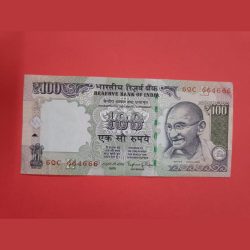 100 Rs Old Issue Semi Fancy Number with Spread Ink Error.