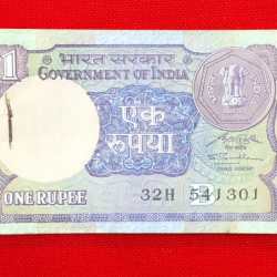 One rupee packet S.P. Shukla A-45 1991 chocolate condition serial no. 541301