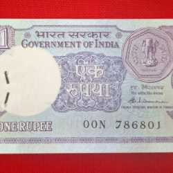 One rupees packet starting 786 and reverse 786 UNC condition serial no. 00N 786801