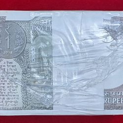 Alternative view of ONE RUPEE RIM A-63 SUBHASH CHANDRA GARG. YEAR 2018 SERIAL NO. 083001