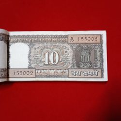 Alternative view of Ten Rs Rare Old Black Boat Pkt Governor RN Malhotra 155001 Unc Condition