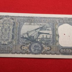 Alternative view of 100 RUPEES NOTE G -9 L. K. JHA RELEASED ON 1967 UNC CONDITION WITH PIN HOLE SERIAL NUMBER 391521