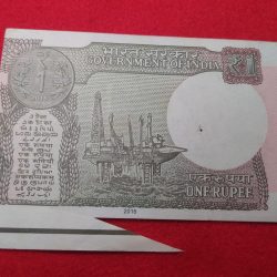 Alternative view of ERROR ONE RUPEE Note CUTTING AND EXTRA PAPER WITH FENCY SERIEL NUMBER 003000