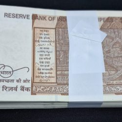 Alternative view of 10 Rupee Packet GEM UNC Condition Serial No. 857601