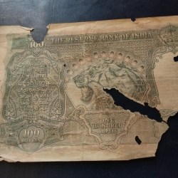 Alternative view of British India 100 ₹ Note Kolkata mint Cd deshmukh Weak condition as per imege Same note given
