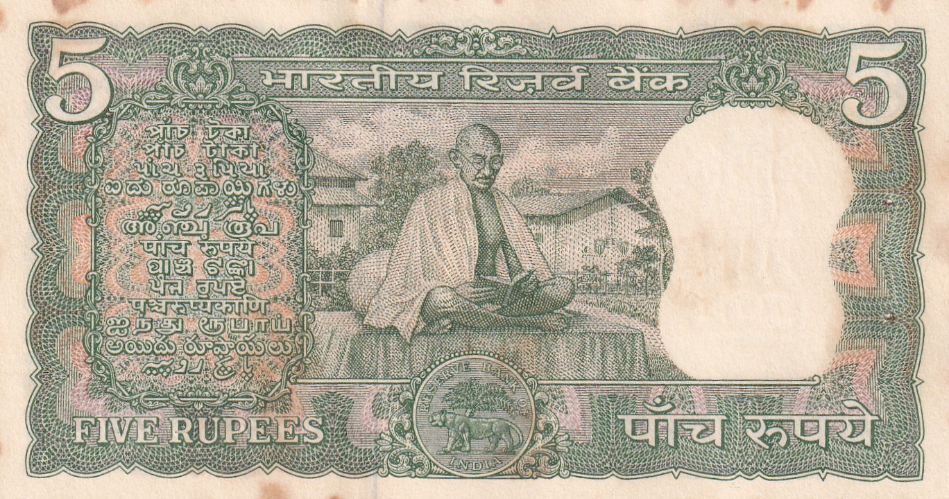 5 RUPEES GANDHI GOVERNOR LAXMI KANT UNC BUT STAIN NOTE