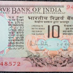 10 Rupees of Republic India (AD 1970-1990) with Two blue peacocks or Indian peafowl (Pavo cristatus) sitting on branches of an old mango tree surrounded by antelopes, horses, flowers, and a bird - R.N. Malhotra