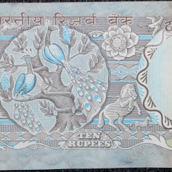 Alternative view of 10 Rupees of Republic India (AD 1970-1990) with Two blue peacocks or Indian peafowl (Pavo cristatus) sitting on branches of an old mango tree surrounded by antelopes, horses, flowers, and a bird - R.N. Malhotra