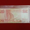 Rare Note Singapore 2 Dollar banknote featuring a traditional tongkang (light wooden boat) from Singapore's Ship Series first issued Gem Unc Condition